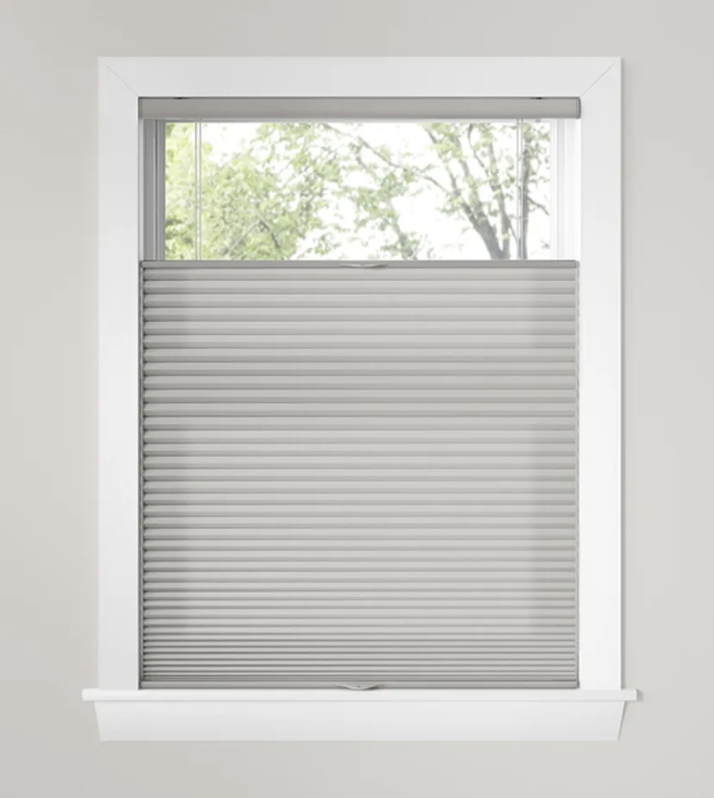 A top down bottom up honeycomb shade lowered from the top