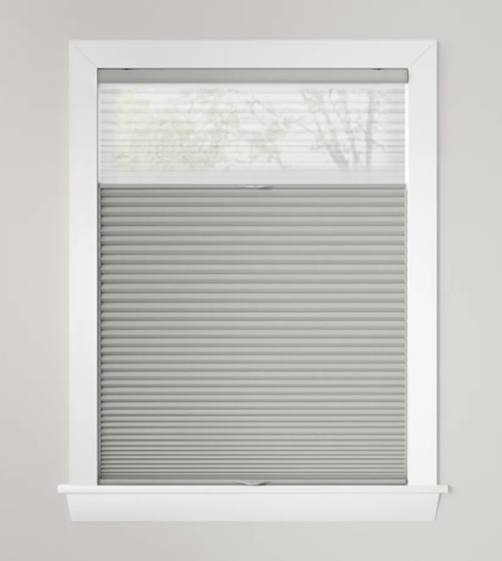 A TriLight shade with a sheer top and honeycomb bottom