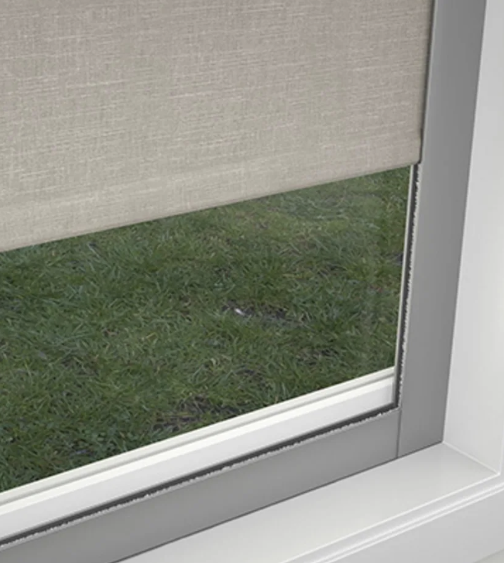 A roller shade running in aluminum side channels