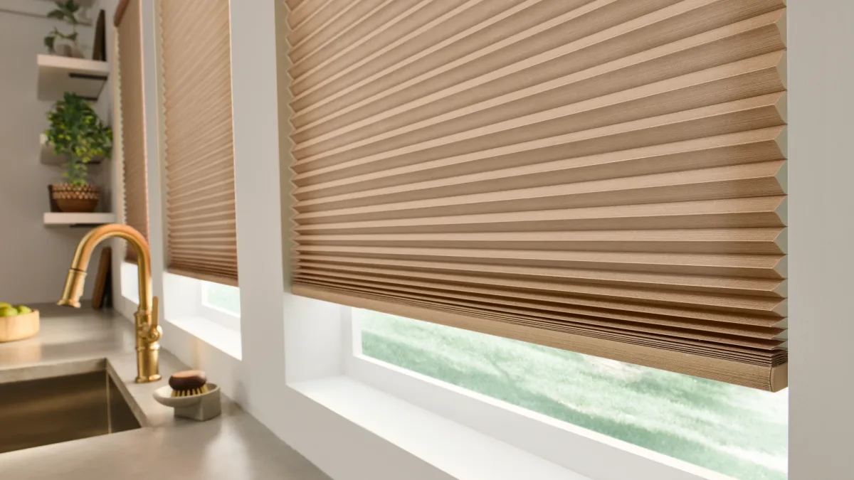 A light filtering Honeycomb Shade over a kitchen sink window